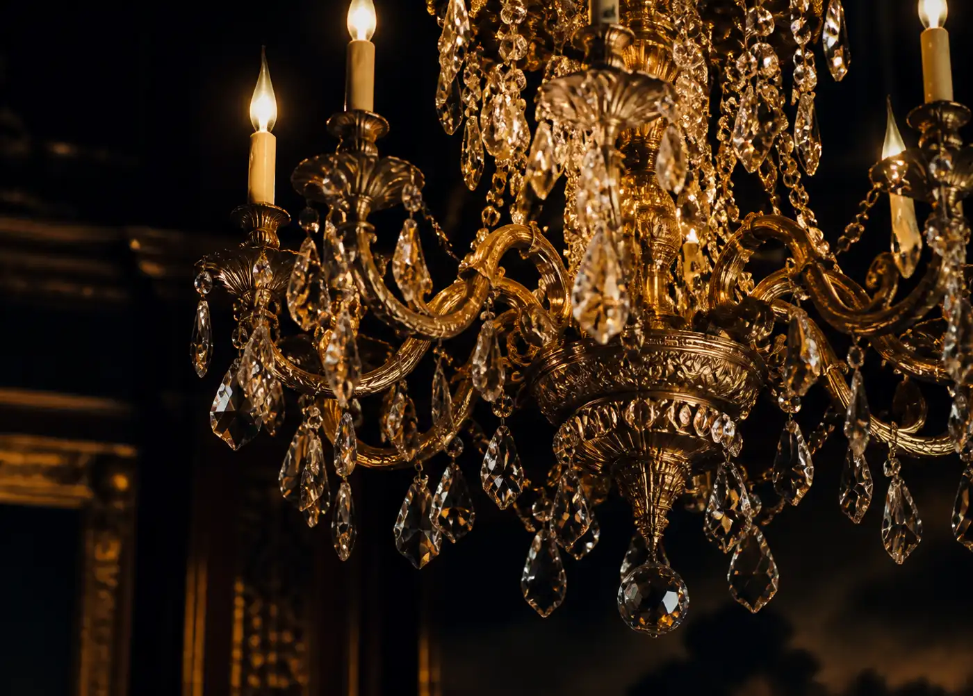 Artisan finishing a brass chandelier
